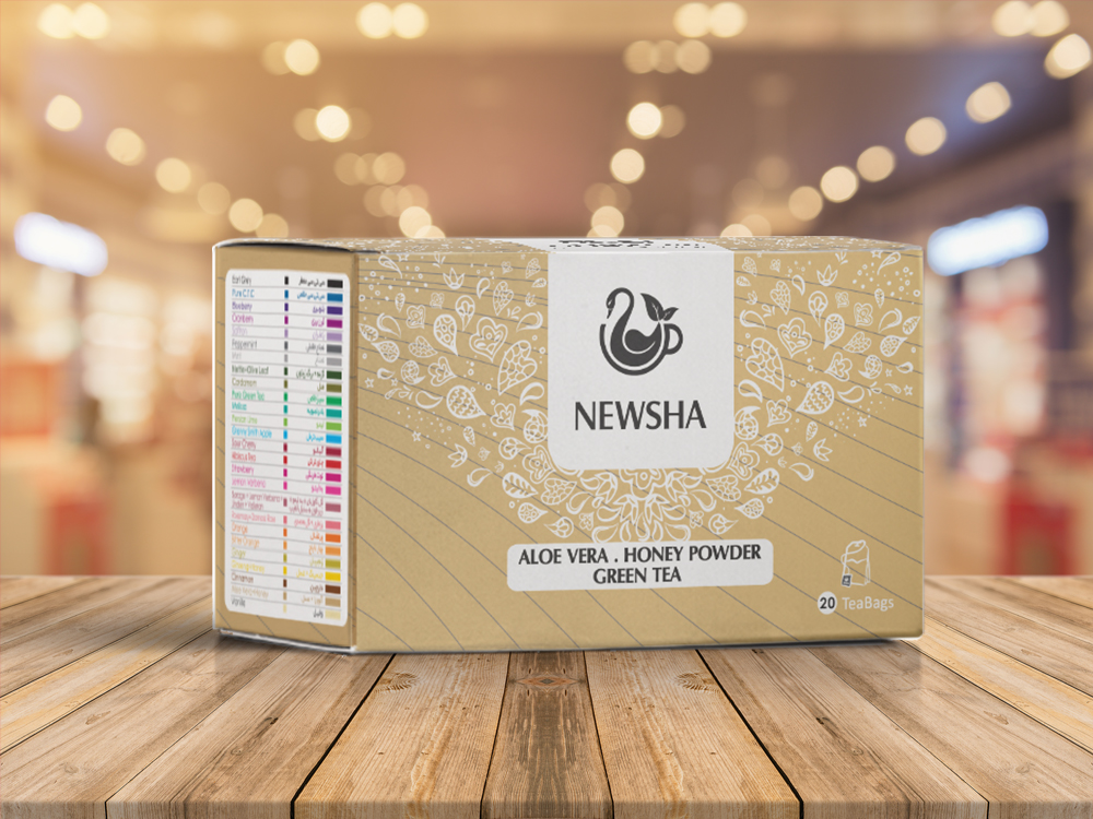 A gold box of Newsha Aloe Vera Honey Powder Green Tea, featuring a logo and colorful tea bag labels on the side. Contains 20 bags.